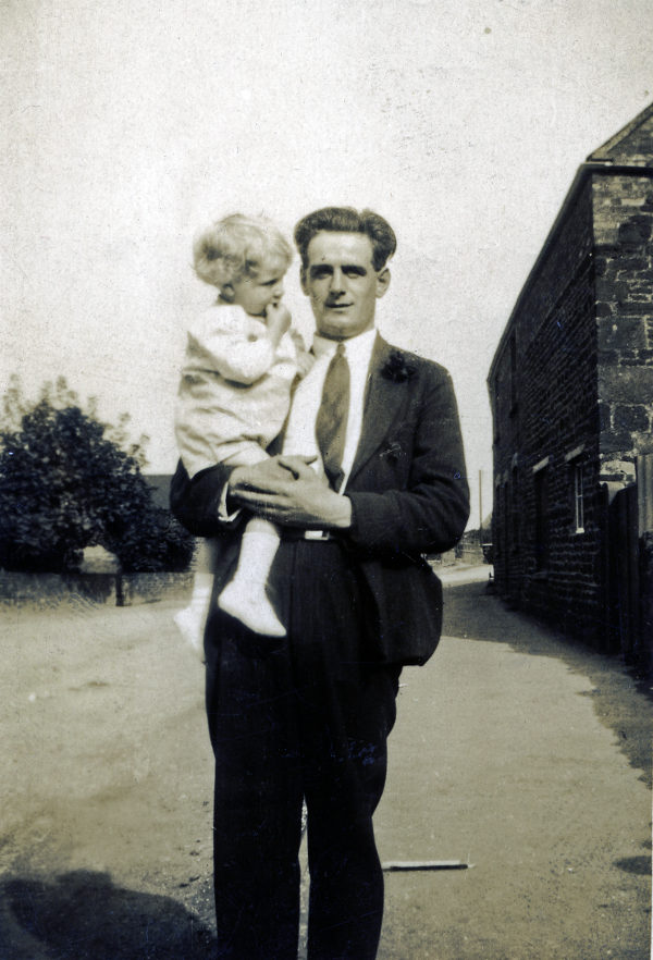 Percy Ward 1935 holding a child whose name is not known.