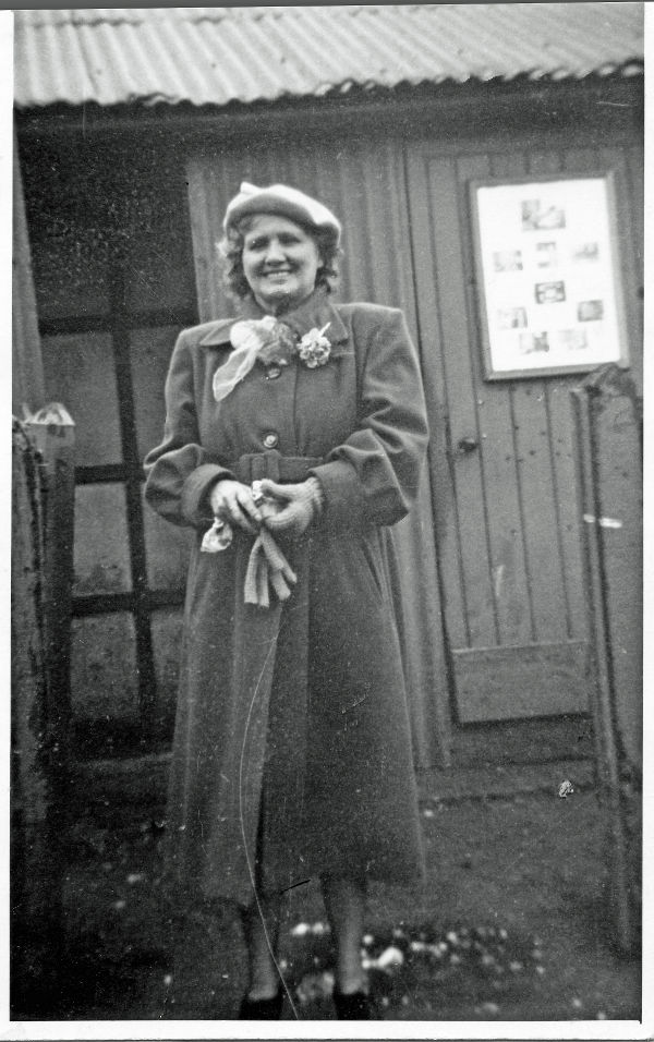 Mrs K Webb outside The Old Tin Hut, Church Street, Woodford Halse